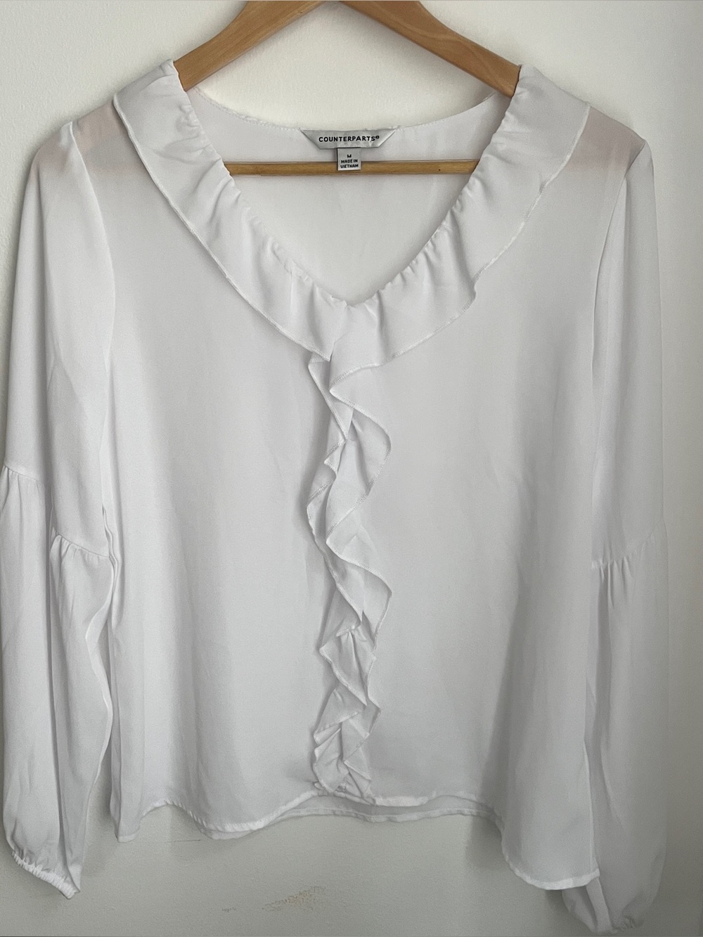 Counterparts sheet white ruffle blouse long sleeve like new size medium
